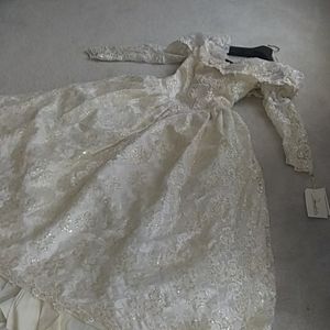 Demetrios cream lace off shoulder bridal gown